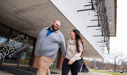 Couple Walking into Building