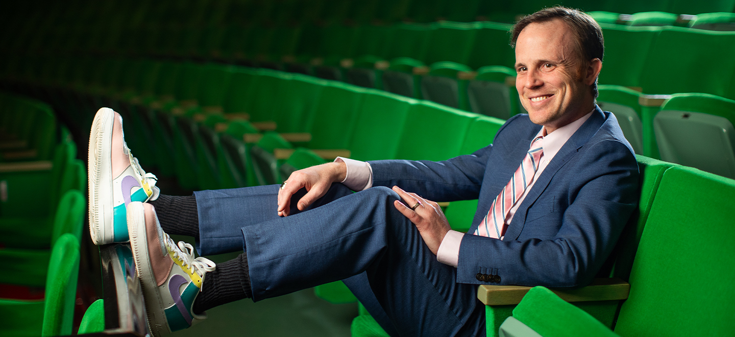 Matt Travis seated in the Center’s Auditorium.