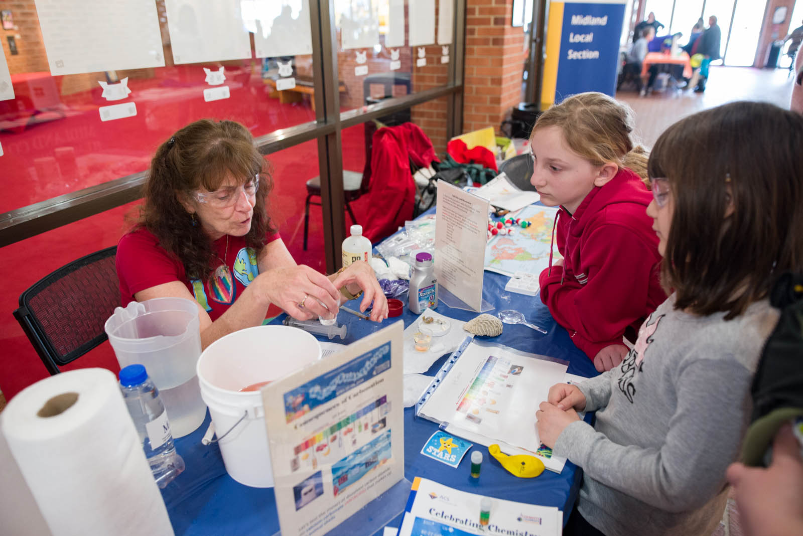 Kids learning at a chemistry exhibit