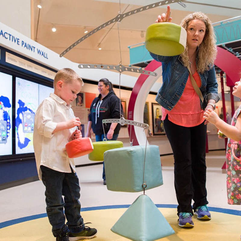 Family playing in museum