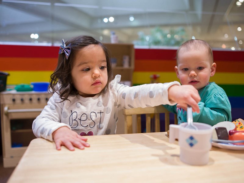 Children playing with toys in museum