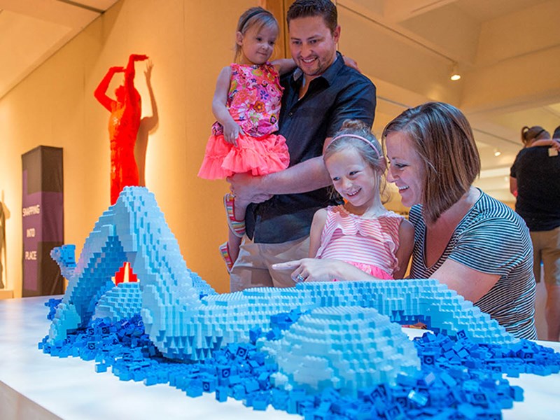 Family interacting with Exhibit