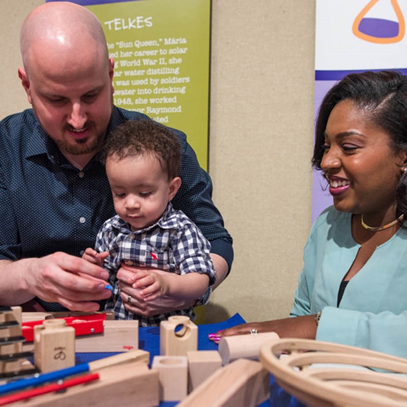 Family playing with Exhibit at the Museum