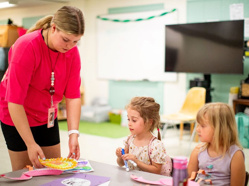 Teacher teaching an interactive lesson to students in a classroom