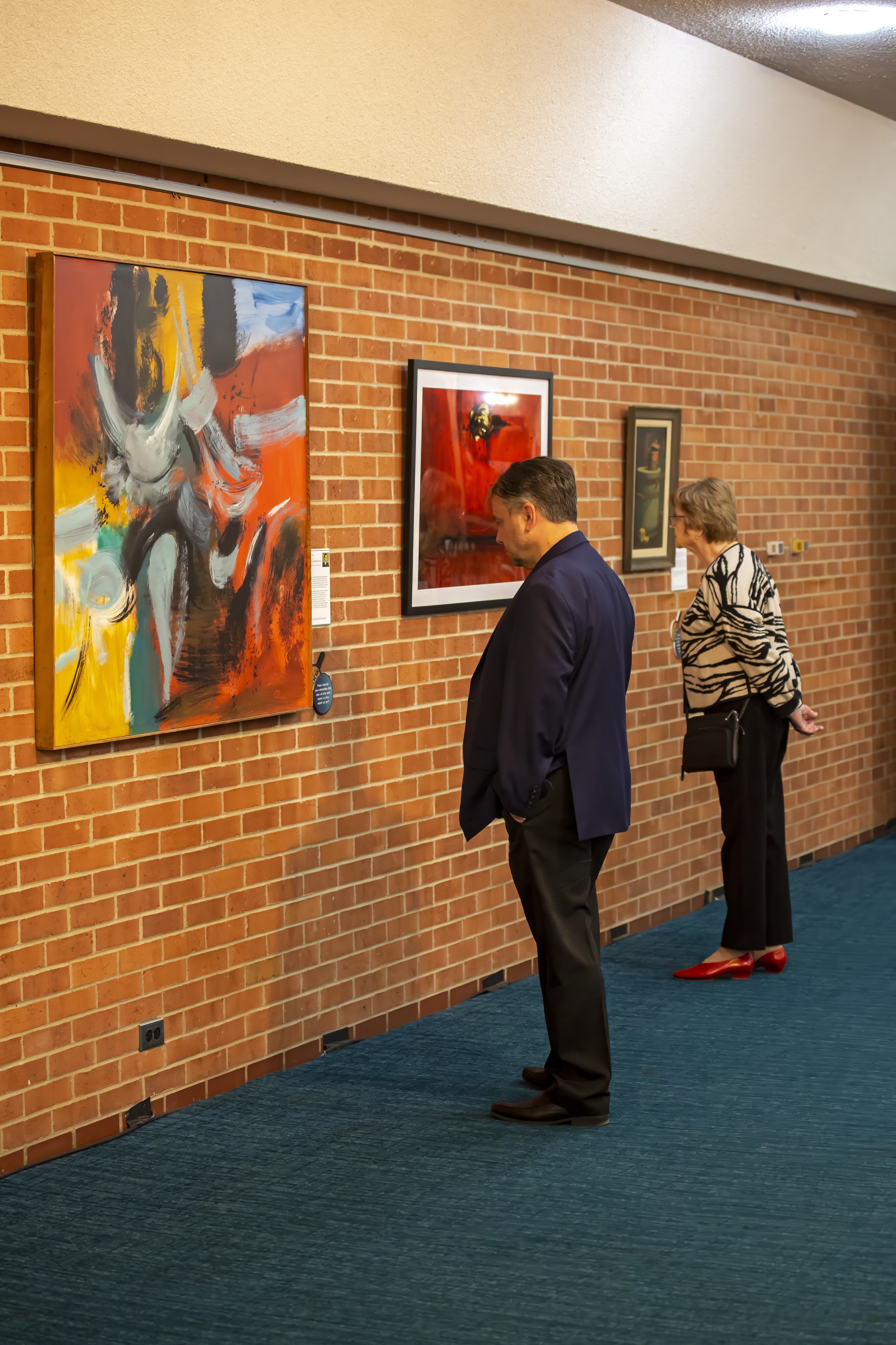 People enjoying an art exhibit